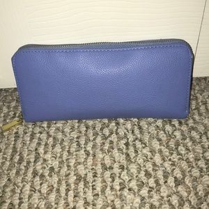 Bright blue wallet with gold detailing